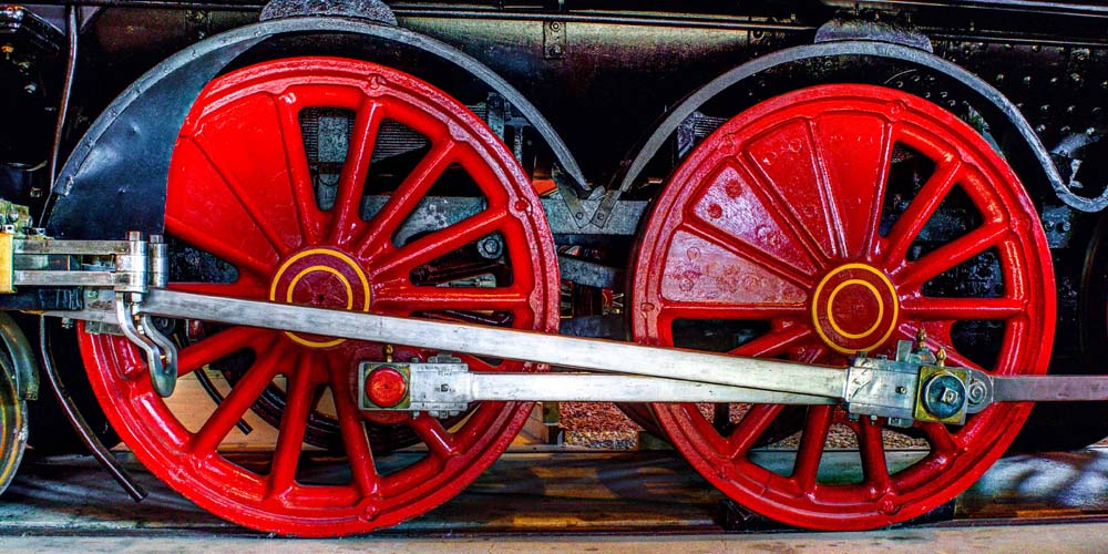 Side view of a railroad truck under a railroad car