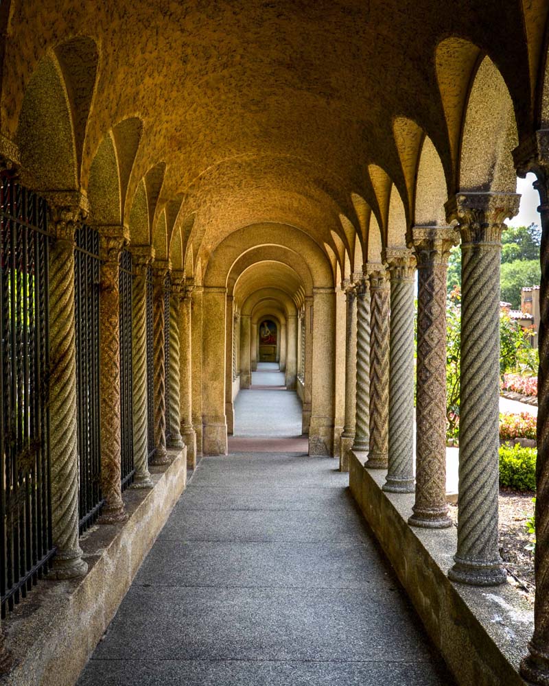 Another view looking down the cloisters toward a chapel with mosaic of Jesus in Gethsemane