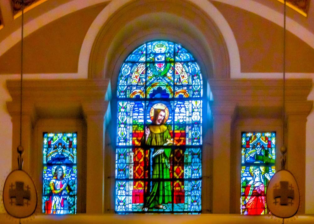 Stained glass windows over the western rise, situated over the western doorways to the church and above the depiction of Crucifiction on Mount Calvary