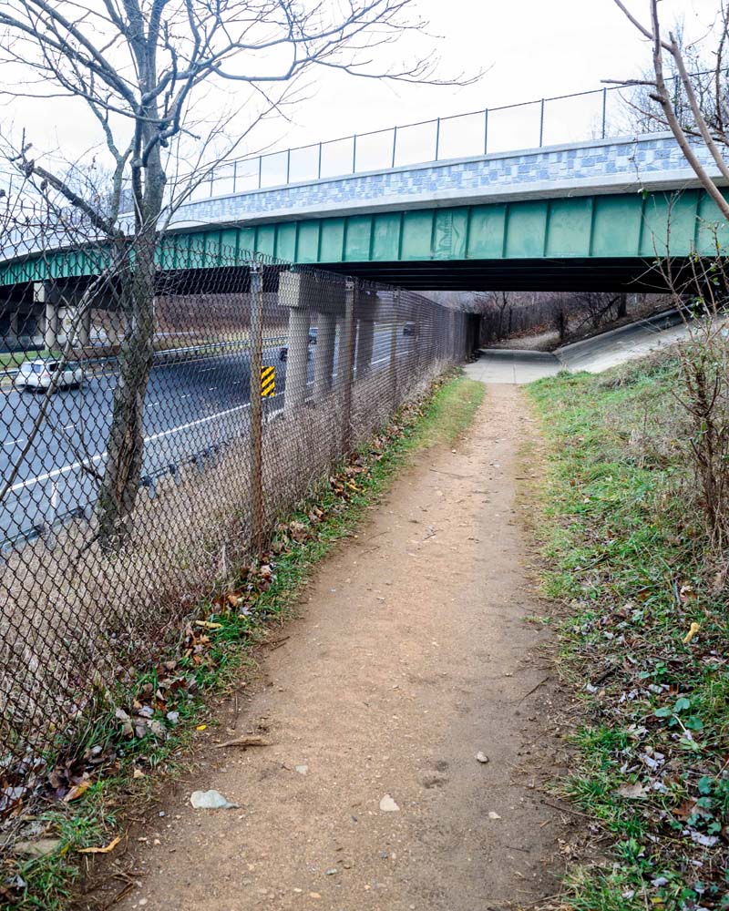 Trail passing under a highway bridge