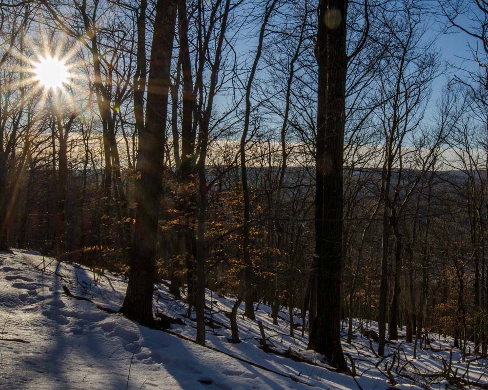 Sun setting over hill-side section of Old Misery Trail