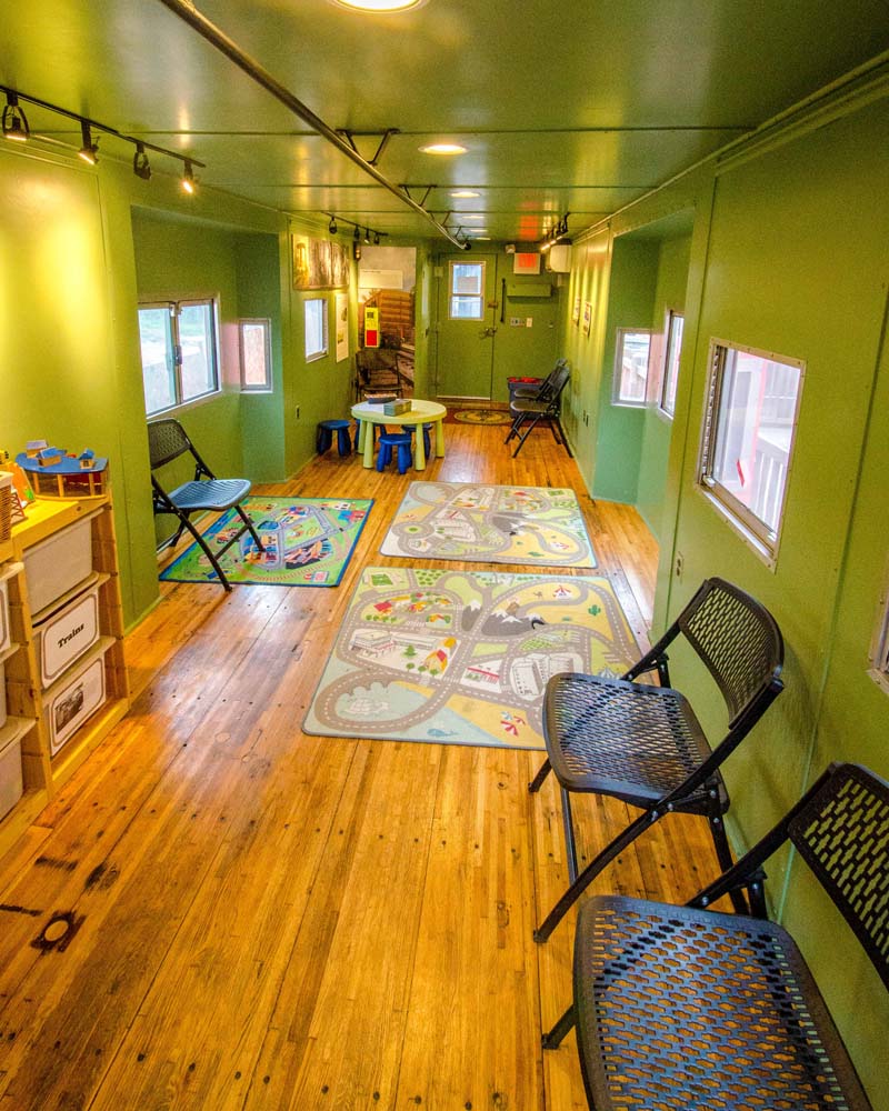 View of inside of historical caboose made into a child friendly play-room.