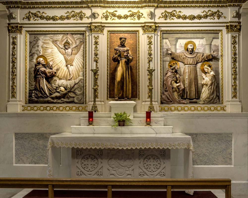 Saint Francis Chapel altar, statue, and two paintings