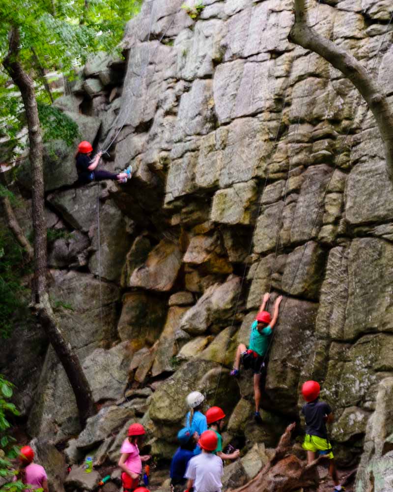 Kids climbing the rocks just off Green Trail near the Summit